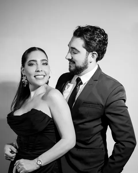 Black and white portrait of a couple dressed for a formal event