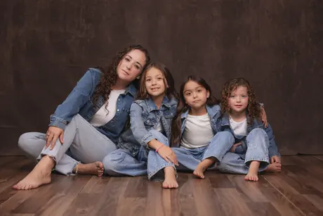 Mother and her three daughters in denim in the studio