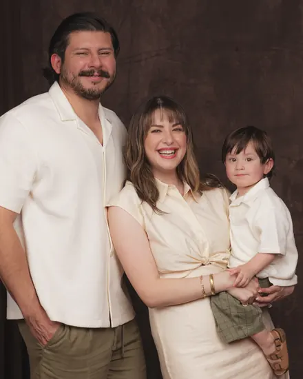 Father, mother and their son together during a studio session